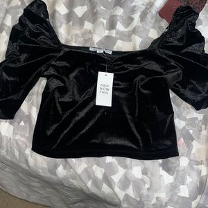 Black velvet three quarter puff sleeve blouse. Never worn! Tags on!